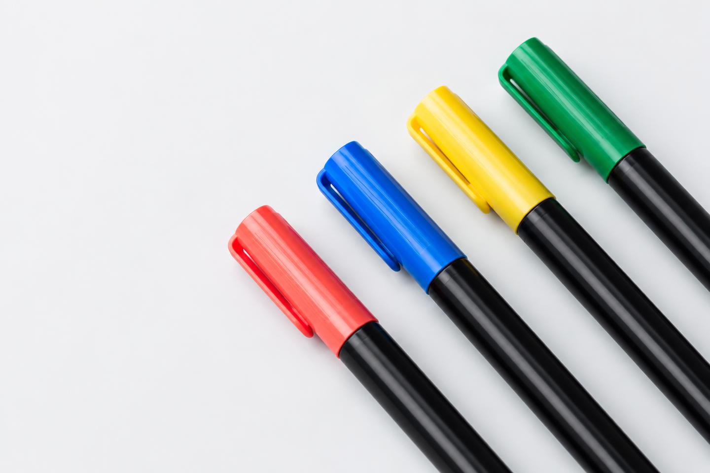Colorful permanent markers arranged diagonally