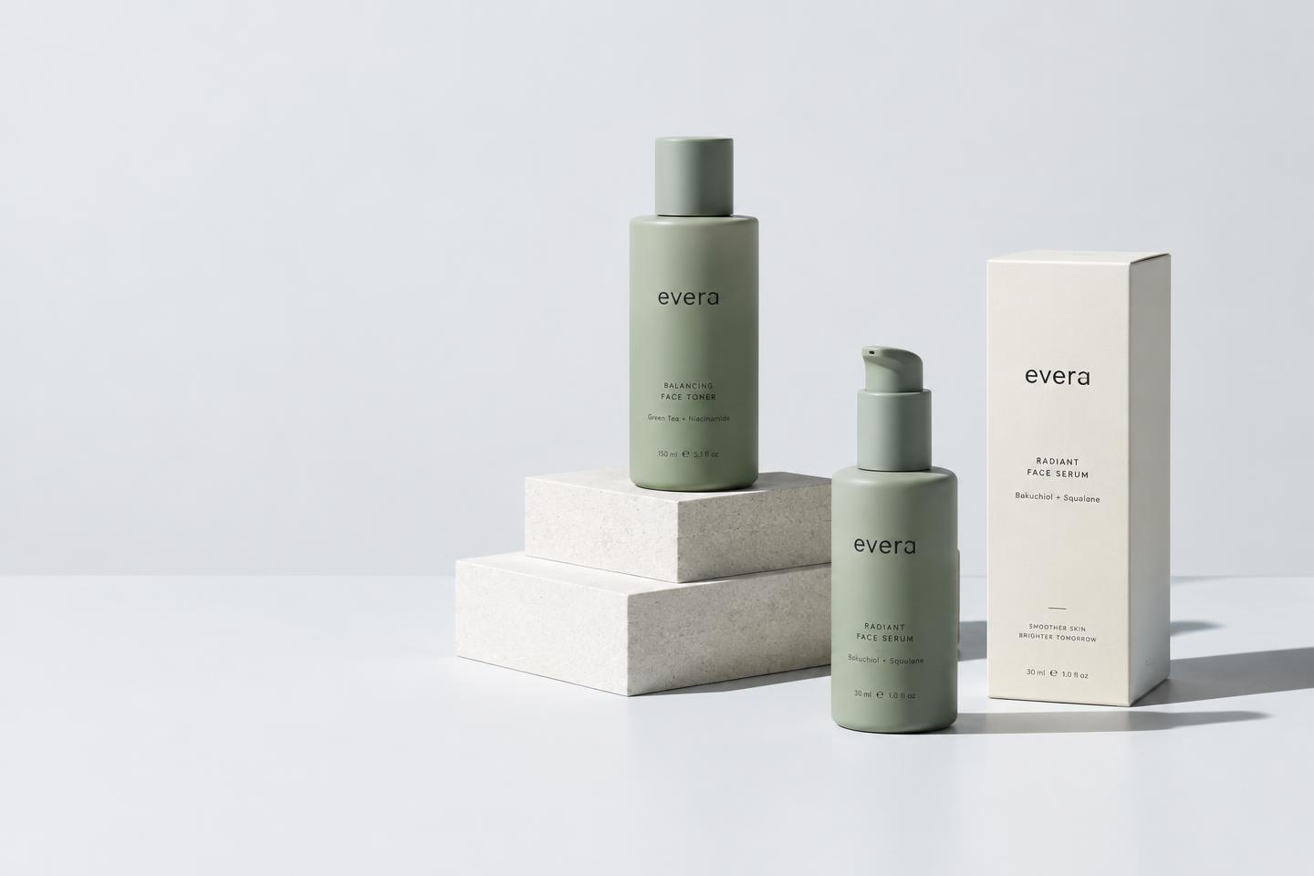 Sage green skincare bottles and packaging on a clean studio backdrop